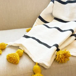 Striped Throw with Yellow Pom Poms